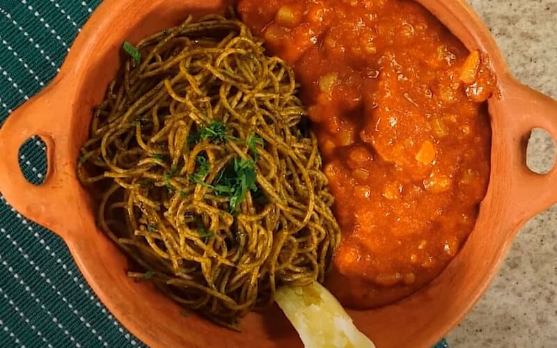 Carapulcra with sopa seca served in a clay pot, a traditional typical dish of the Peruvian coast