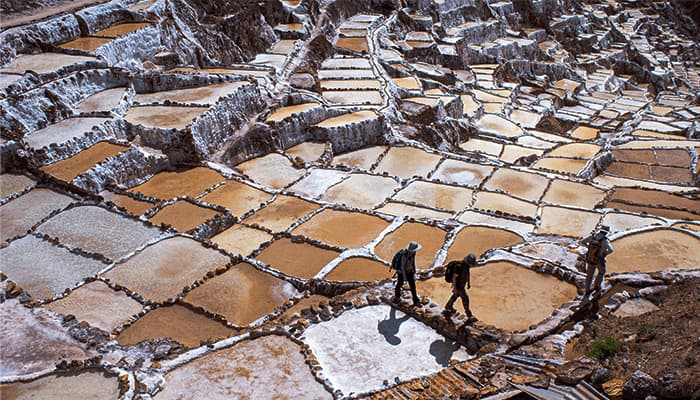 Tourists visiting the Maras Salt Mines