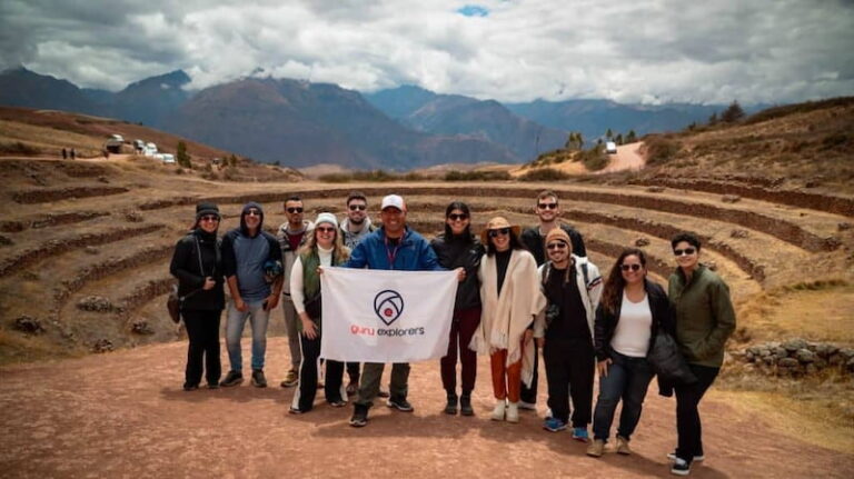 Group of tourists at Moray, Cusco, enjoying a trip to Peru with all the requirements in order