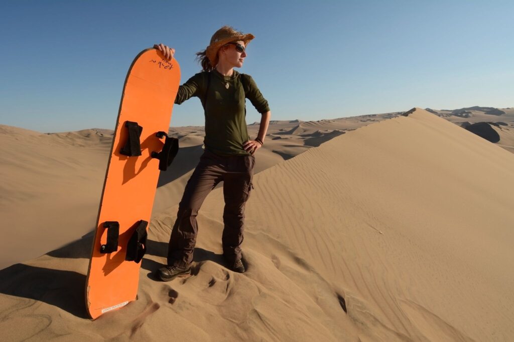 tourist about to go sandboarding on the Huacachina dunes